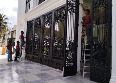 Workers working on Door grill works 1 D elegant metal works